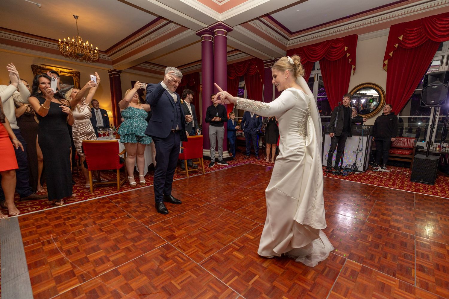 bride and groom take to the dance floor for their first dance at the Athenaeum Liverpool. city centre wedding photographer Stuart Morris
