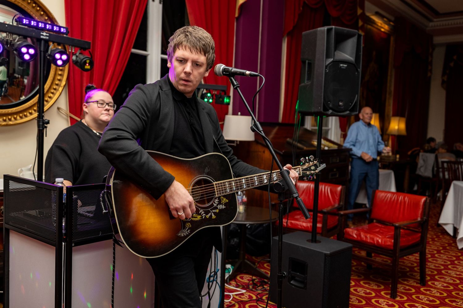 jack from stillia plays guitar and sings at the atheneum wedding entertaining wedding guests on the dance floor. Stuart Morris Photography