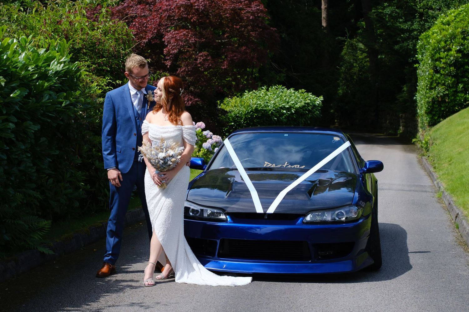 Bride and Groom with Grooms sports car at Merewood Country House Hotel