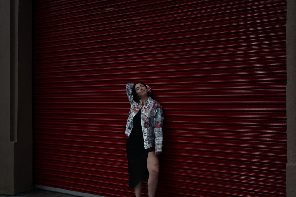 Silhouette against red industrial backdrop in dramatic lighting. Lifestyle photography, San Diego, California