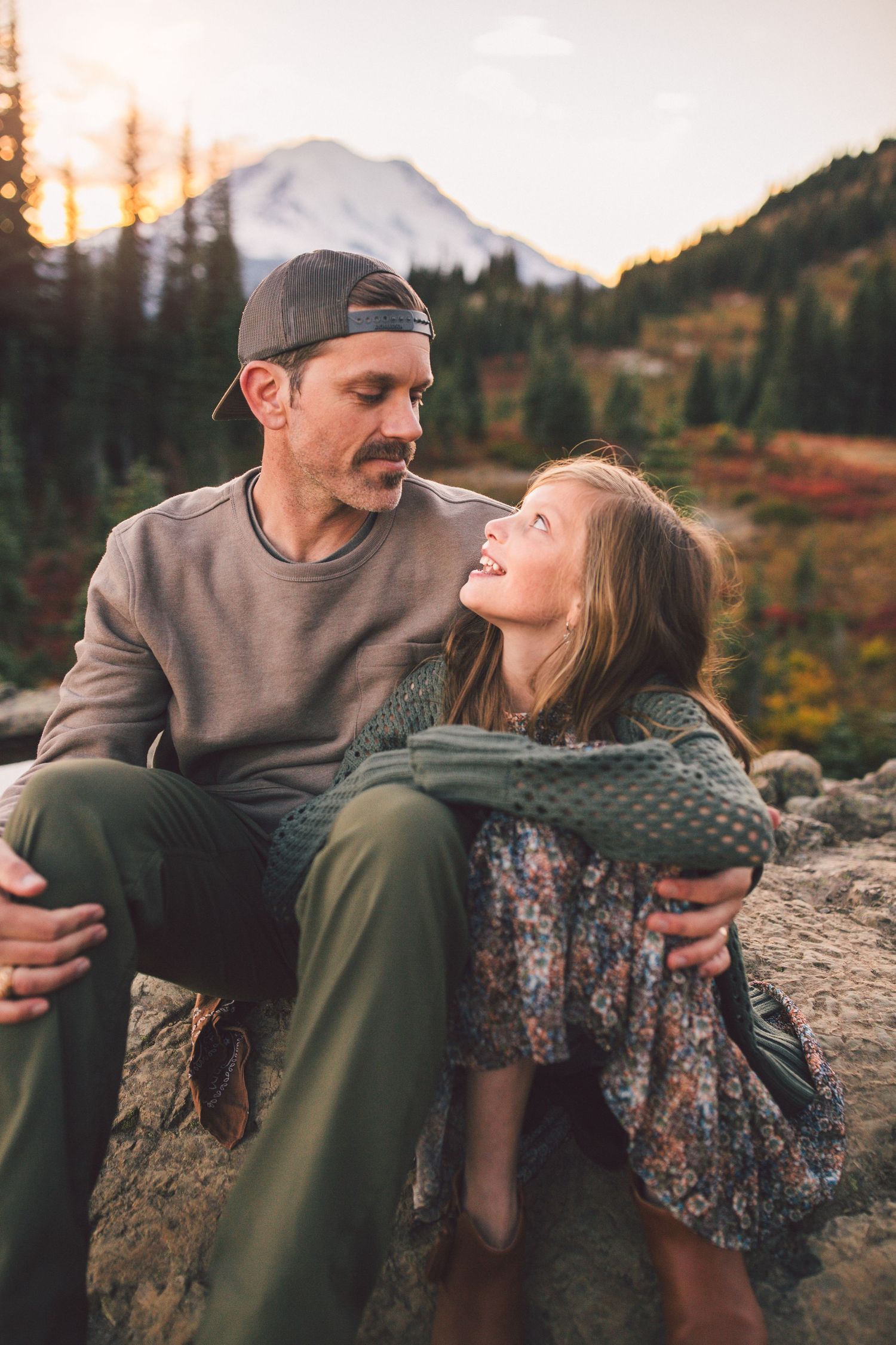 Dad and daughter sitting together during a family photoshoot in Mt. Rainier National Park in Washington