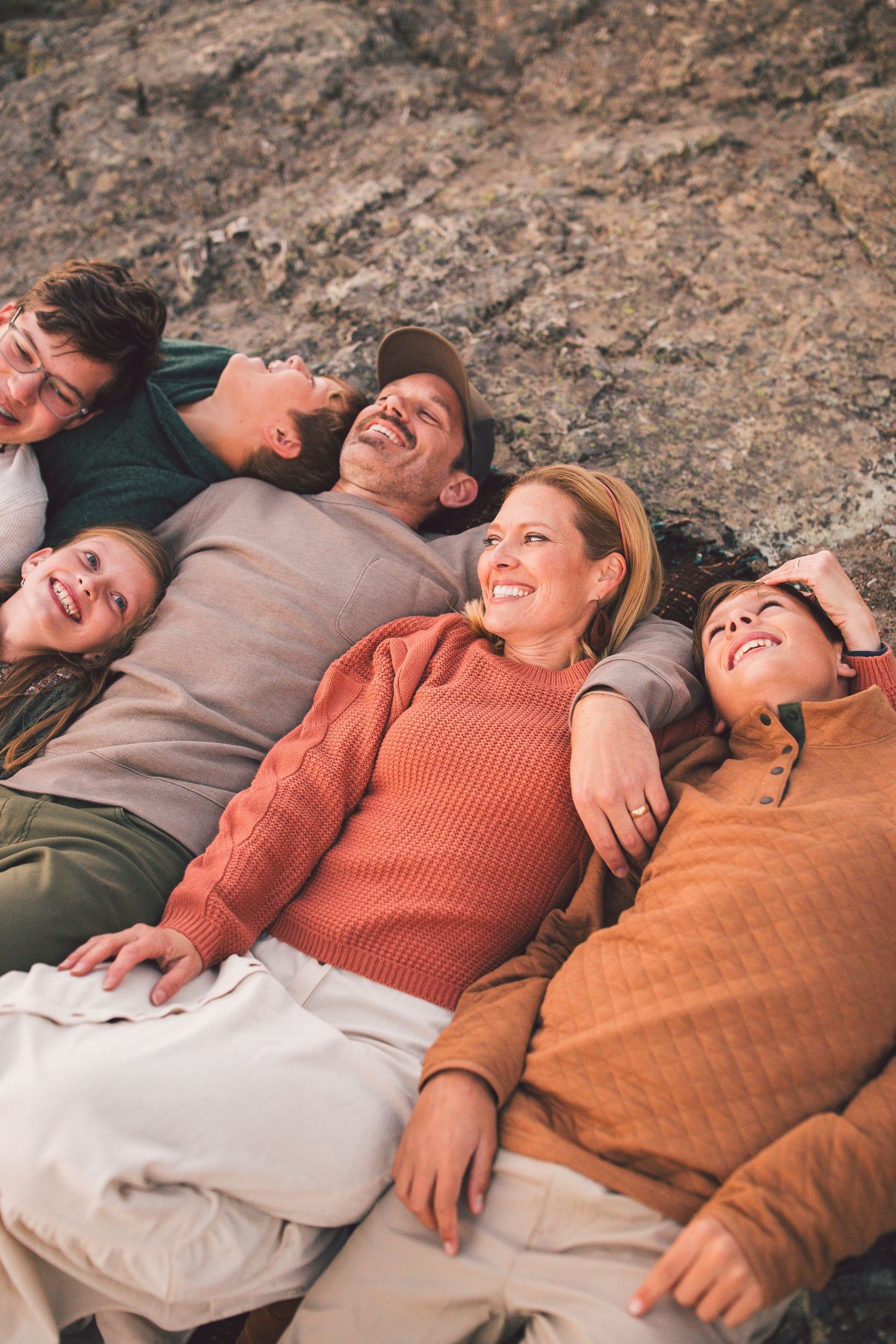 Family laying down together during a family photoshoot in Mt. Rainier National Park in Washington