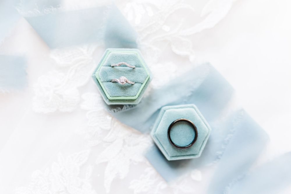 Light blue hexagonal ceramic tiles with white grout create a modern geometric pattern against a white background.