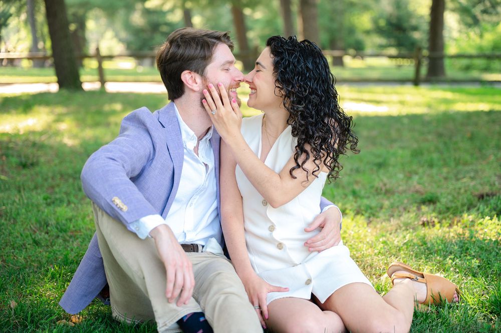 A romantic couple shares an intimate moment during an engagement session in Central Park. Photo by by Joliette Marie Photography.