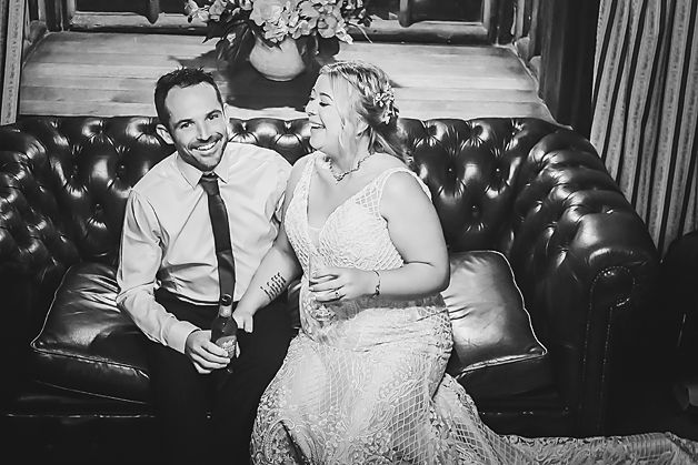 A black and white photo collage showing intimate moments between a couple on a leather couch.