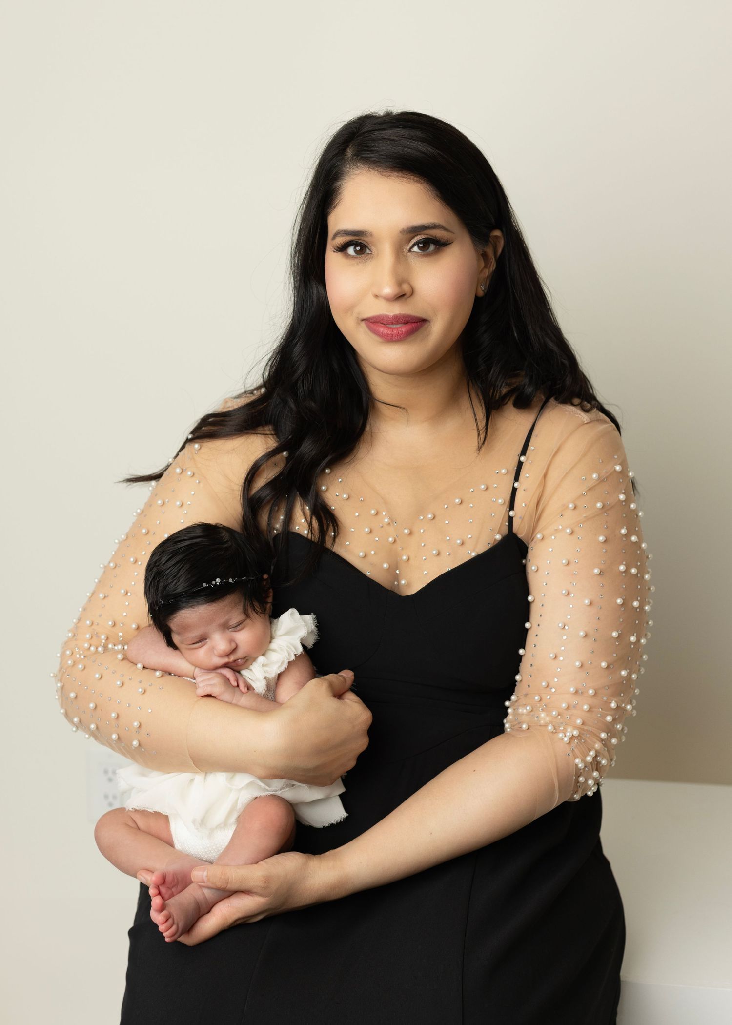 Elizabeth Lang Photography. Twin newborn photography Surrey. mom holds her baby