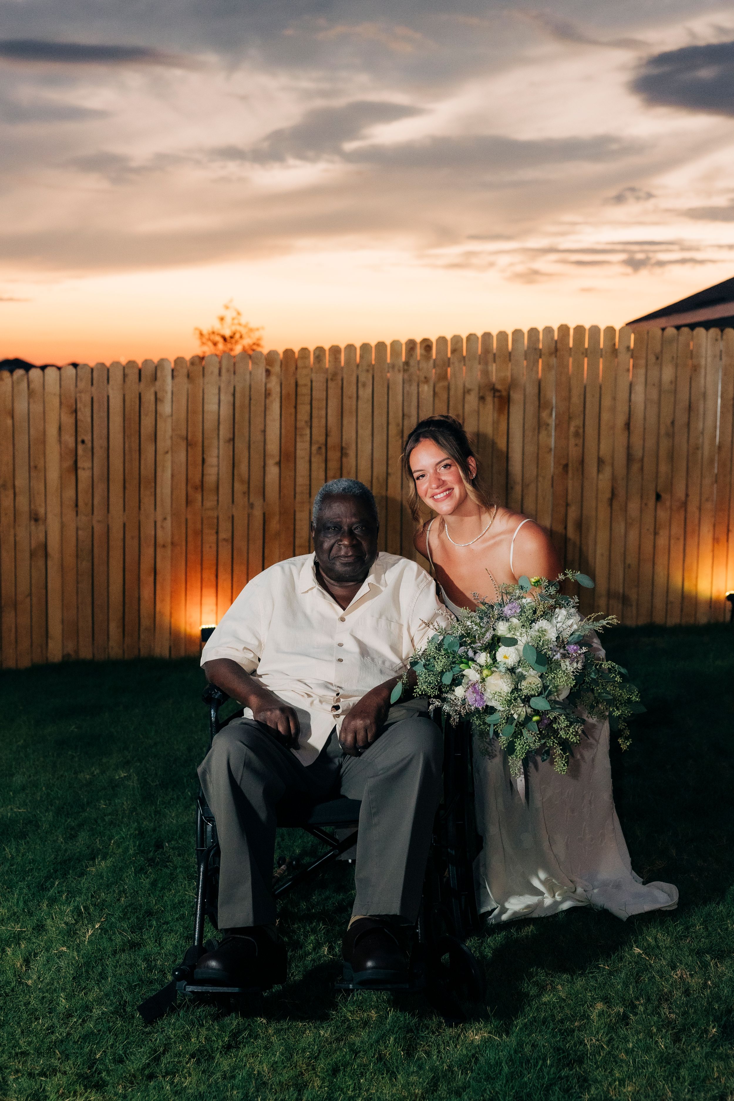 Full family portrait after outdoor backyard ceremony at summer wedding in Fort Worth, Texas