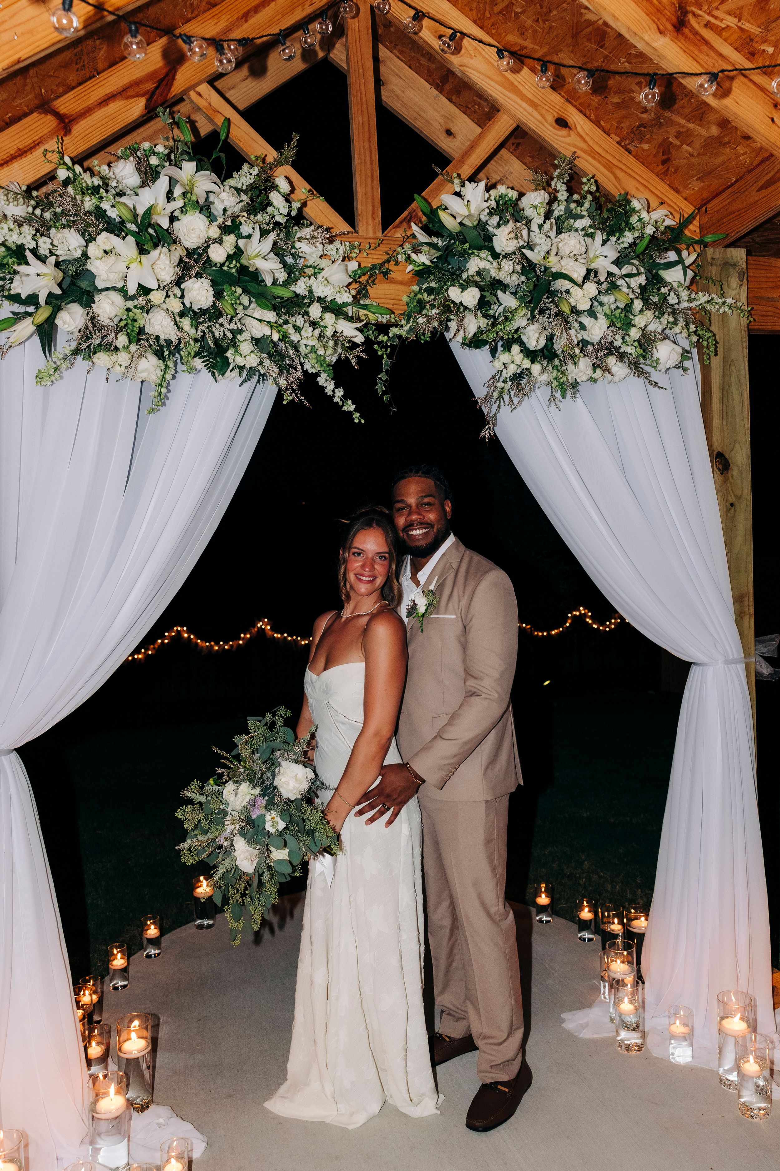 Outdoor backyard ceremony under string lights at a small Fort Worth wedding