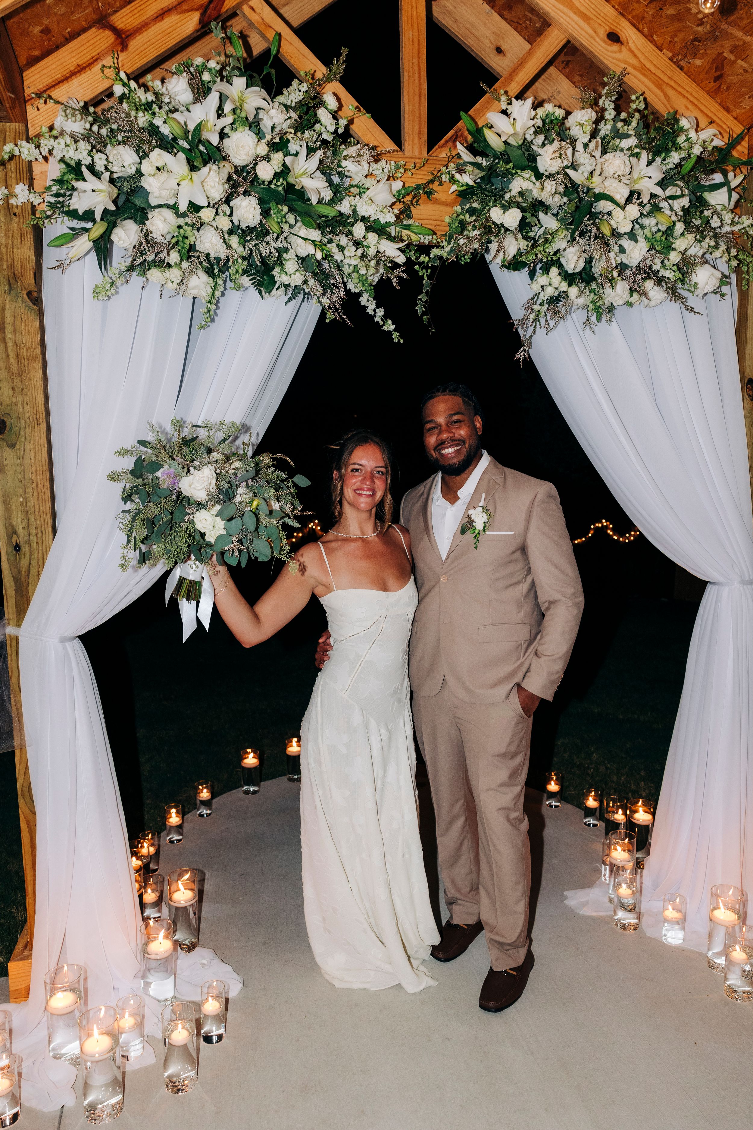 Outdoor backyard ceremony under string lights at a small Fort Worth wedding
