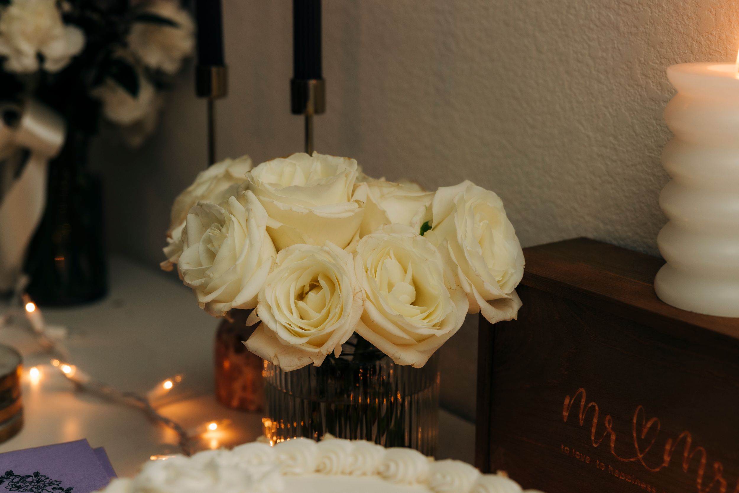 Rustic backyard wedding reception setup in Fort Worth, TX with summer decor and candlelight