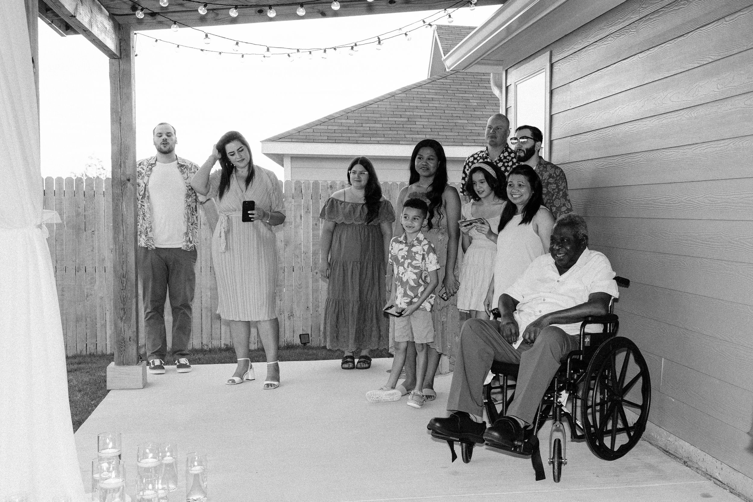Full family portrait after outdoor backyard ceremony at summer wedding in Fort Worth, Texas