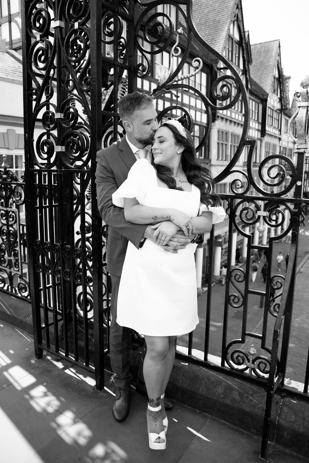 Bride and groom portraits in Chester city centre Eastgate alternative bride and groom wedding