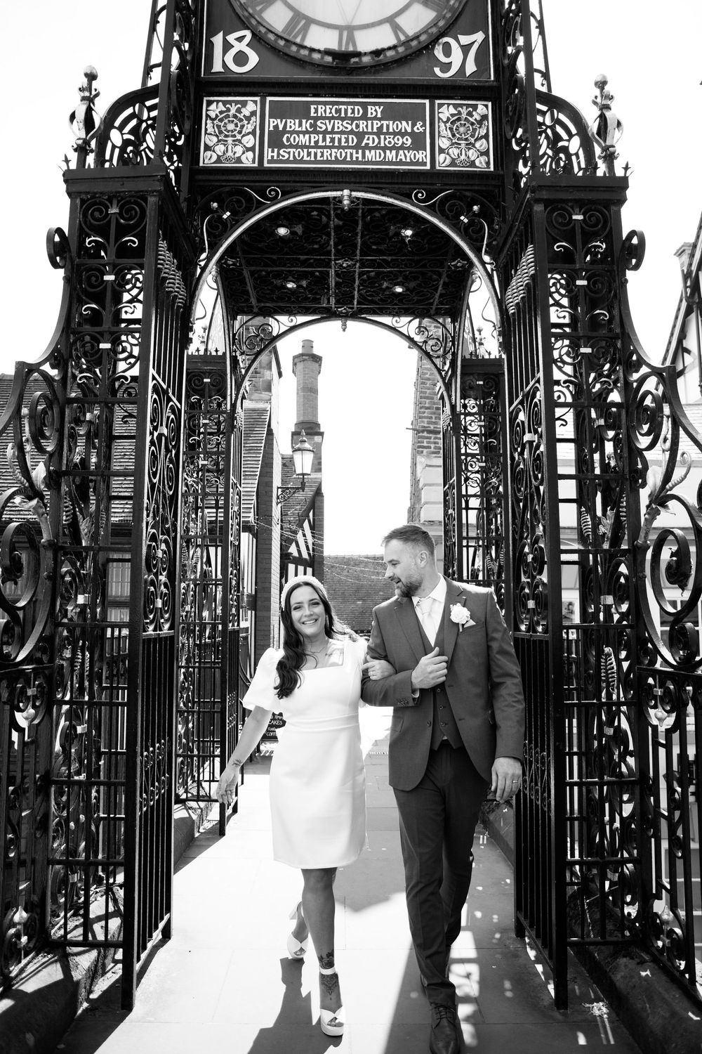 Bride and groom portraits in Chester city centre Eastgate alternative bride and groom wedding
