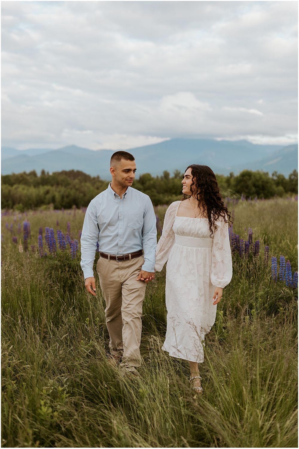 Summer engagement pictures in a NH lupine field