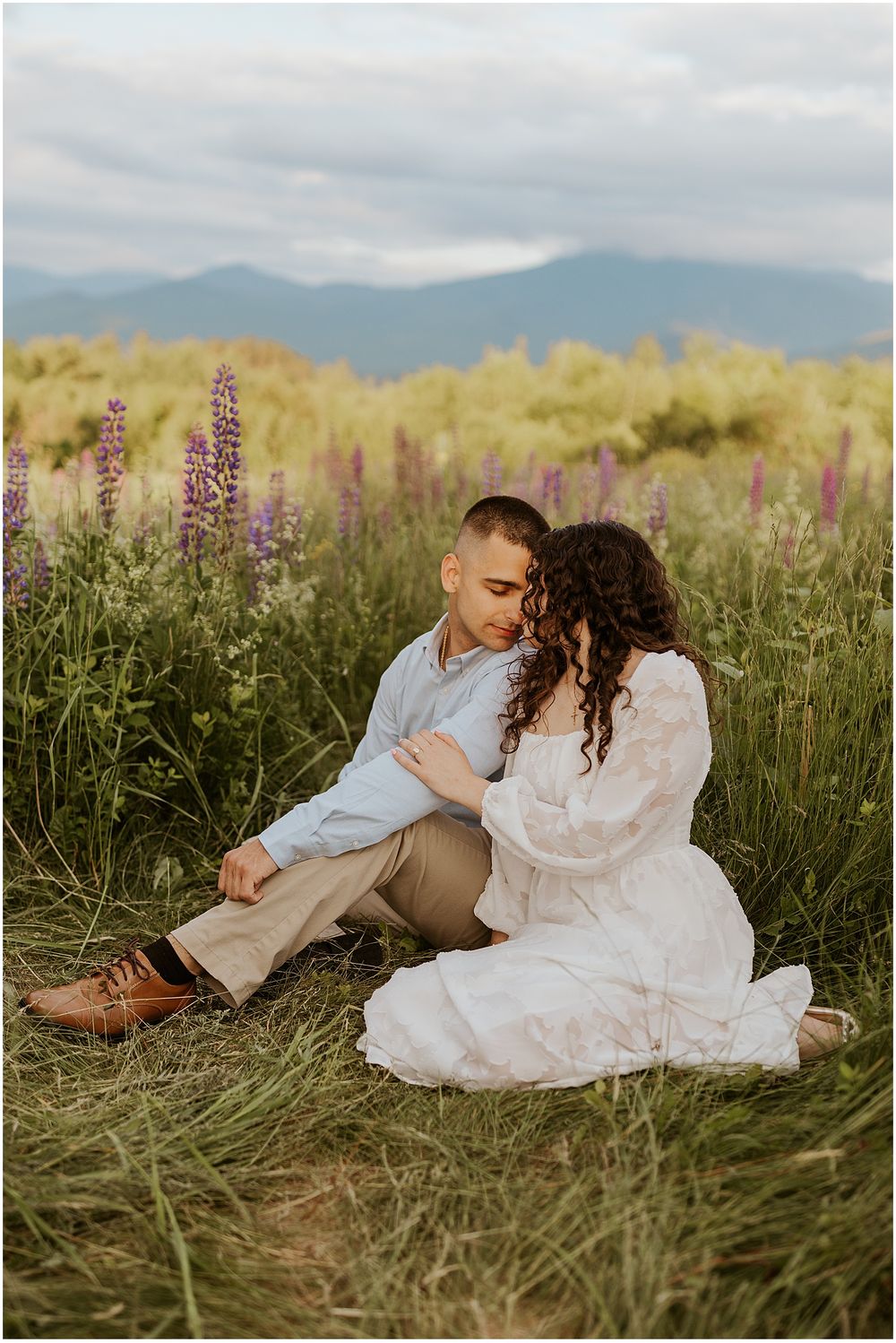 A NH couple taking engagement pictures in the mountains