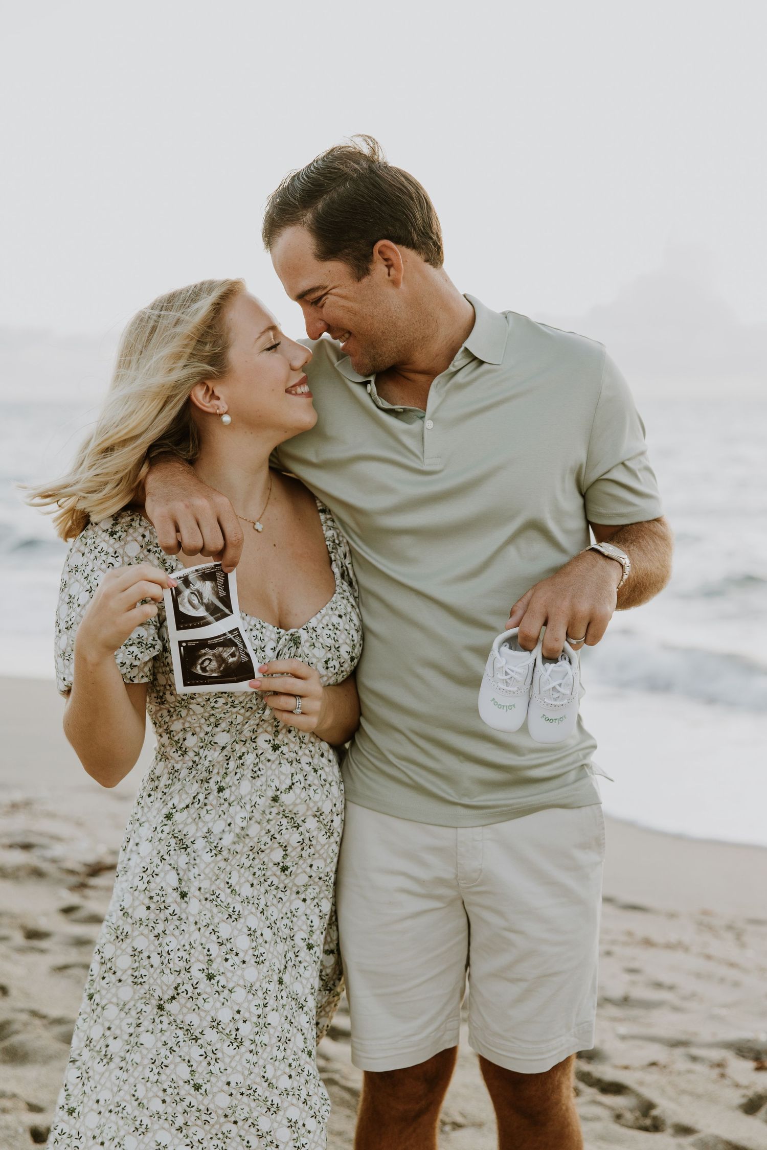Sunrise summer pregnancy announcement photos on the beach captured by Lindsay McDow Photography