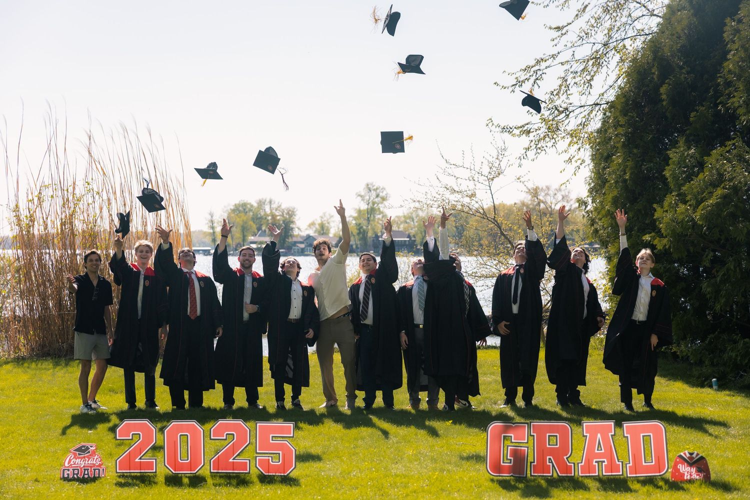 uw madison university of wisconsin alumni graduation graduates professional photos party event candid fraternity brothers throwing caps gown