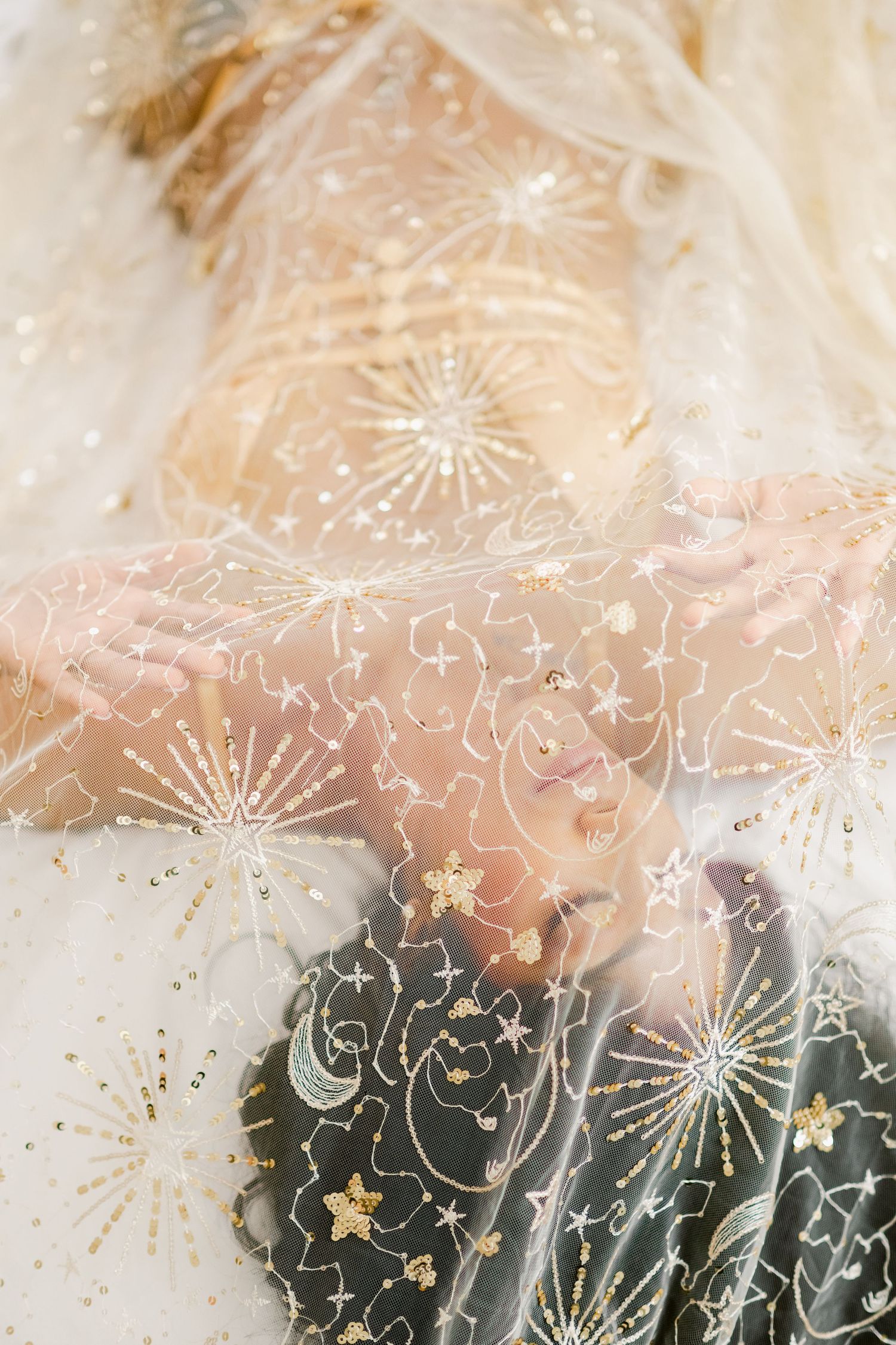 Black and nude watercolor abstract art features delicate white line drawings of stars and celestial patterns.