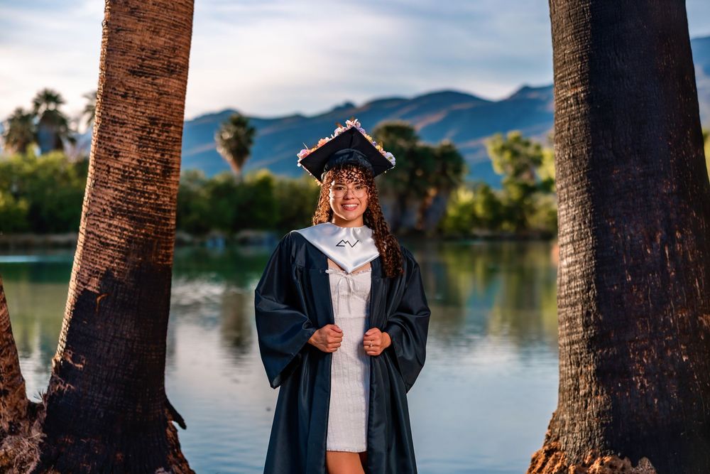 Golden hour senior photo at Agua Caliente Park with palm trees and pond, Tucson, AZ Senior pictures