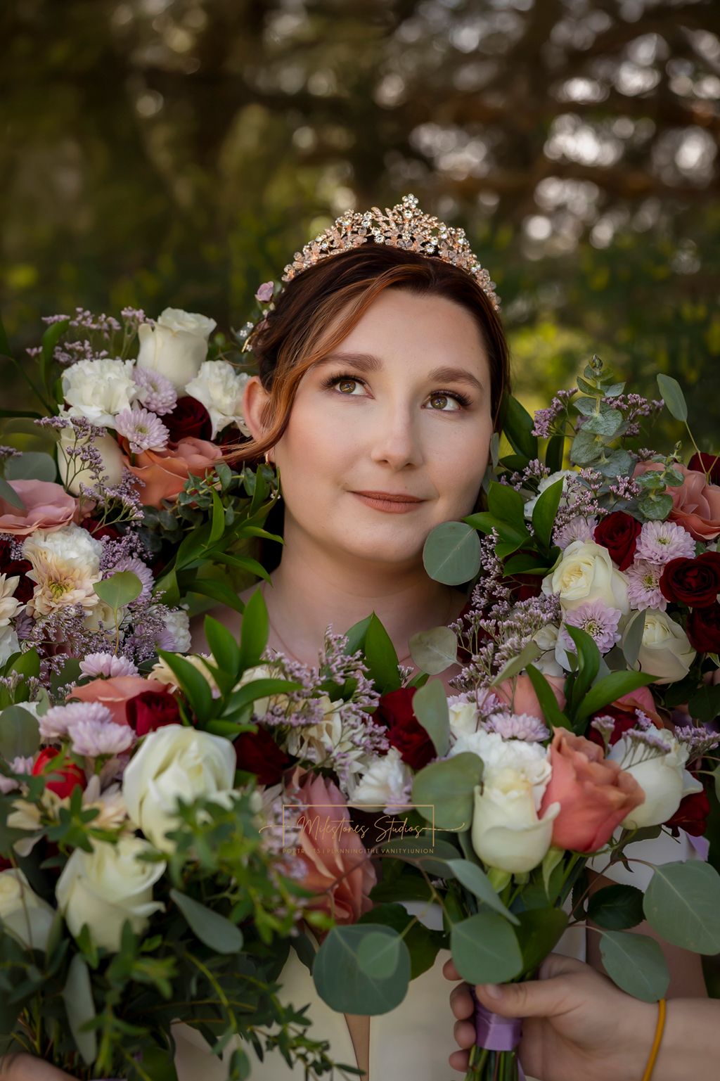 bride with bouquets surrounding her face