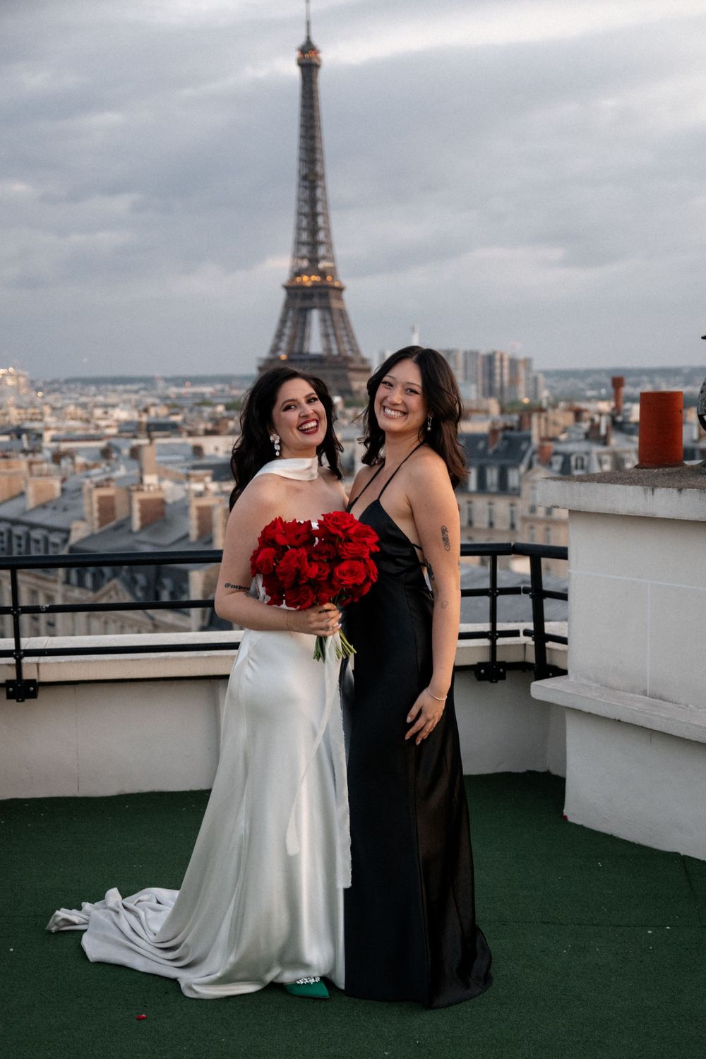 Wedding celebration on a Paris rooftop with the iconic Eiffel Tower visible in the background.