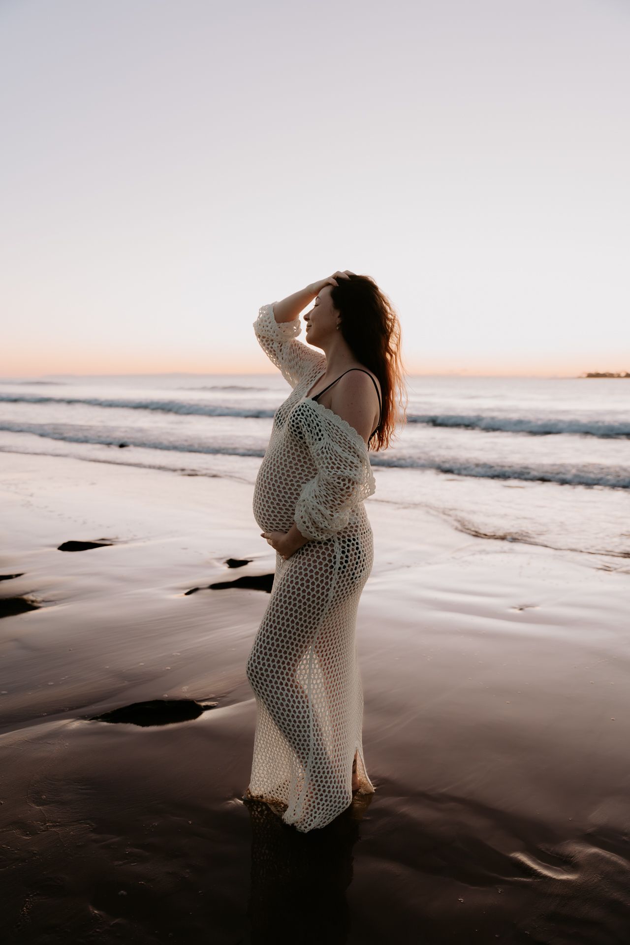 A figure in a white dress poses on a beach at sunset in multiple artistic shots.