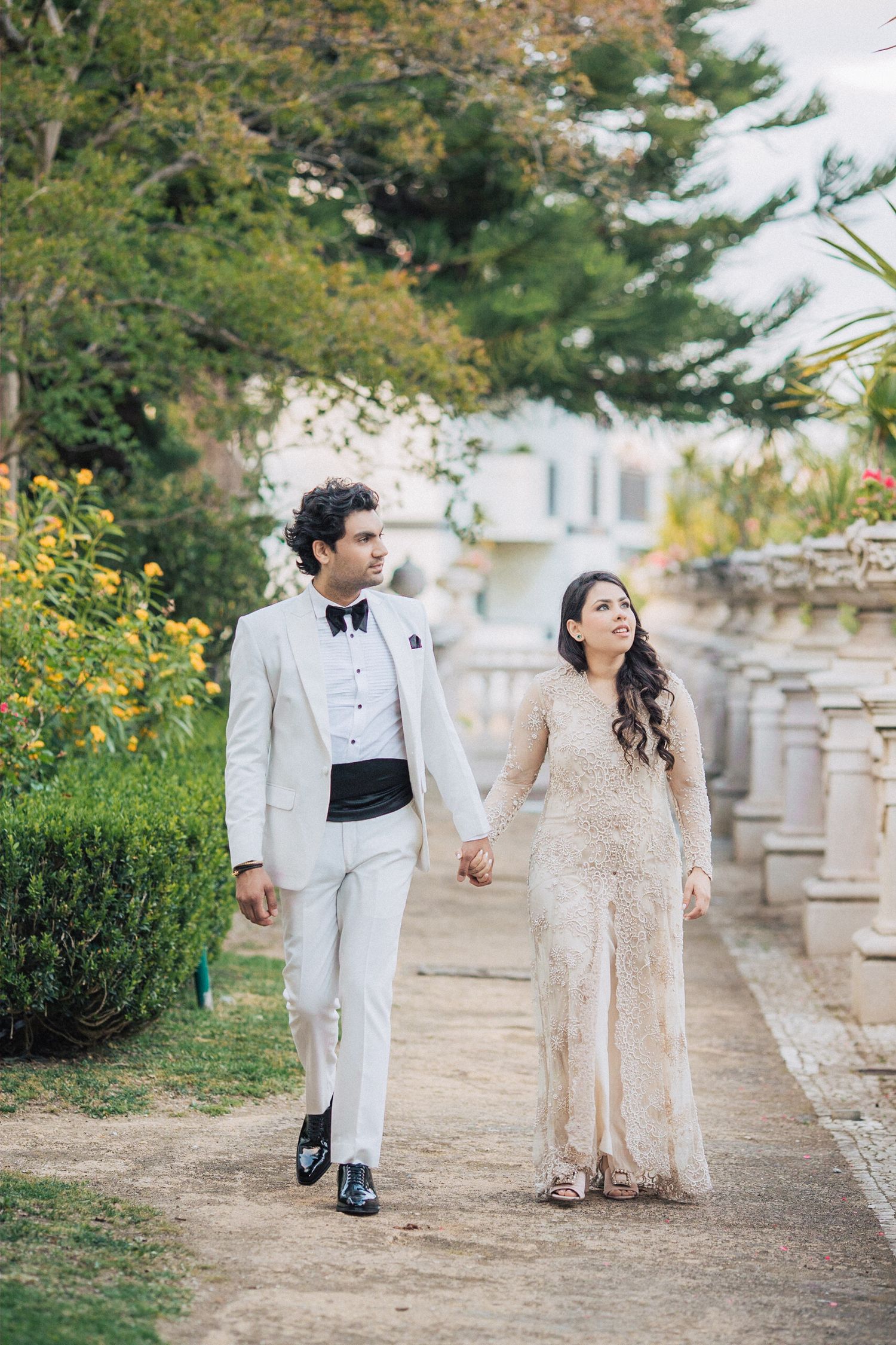 Romantic and sophisticated couple posing in the grand surroundings of Pestana Palace, Lisbon