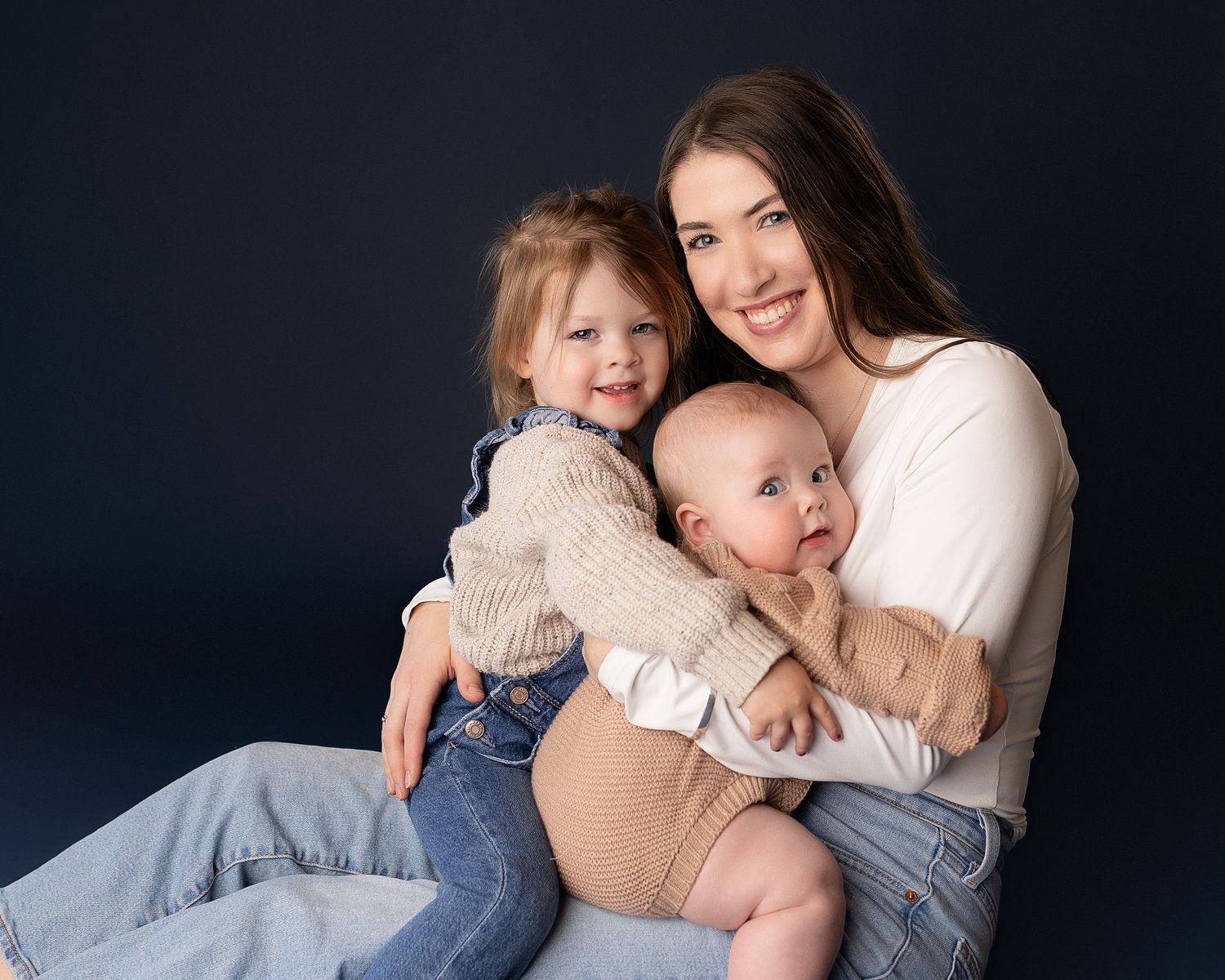 Professional photo of a mother with her two daughters