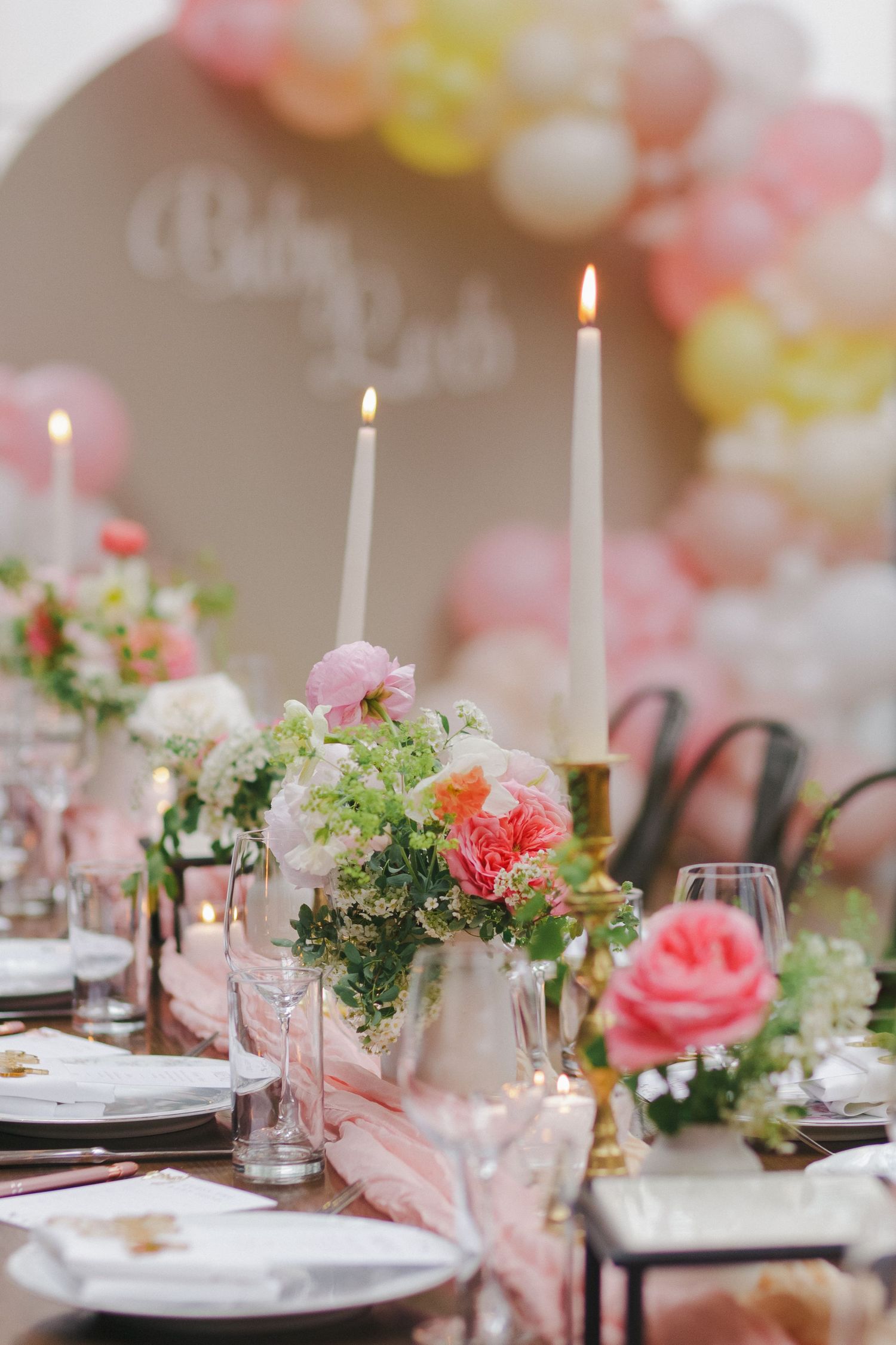Elegant table setting with floral arrangements at a Brooklyn Winery baby shower brunch, photographed by Paula Brearley.