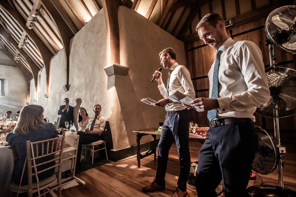 Two men giving a best man speech