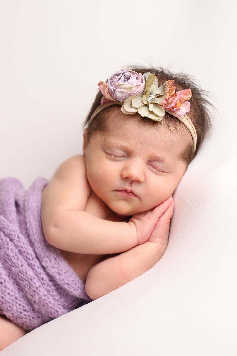 Buffalo In Home Newborn Session Photography. Newborn girl with purple lavender swaddle.