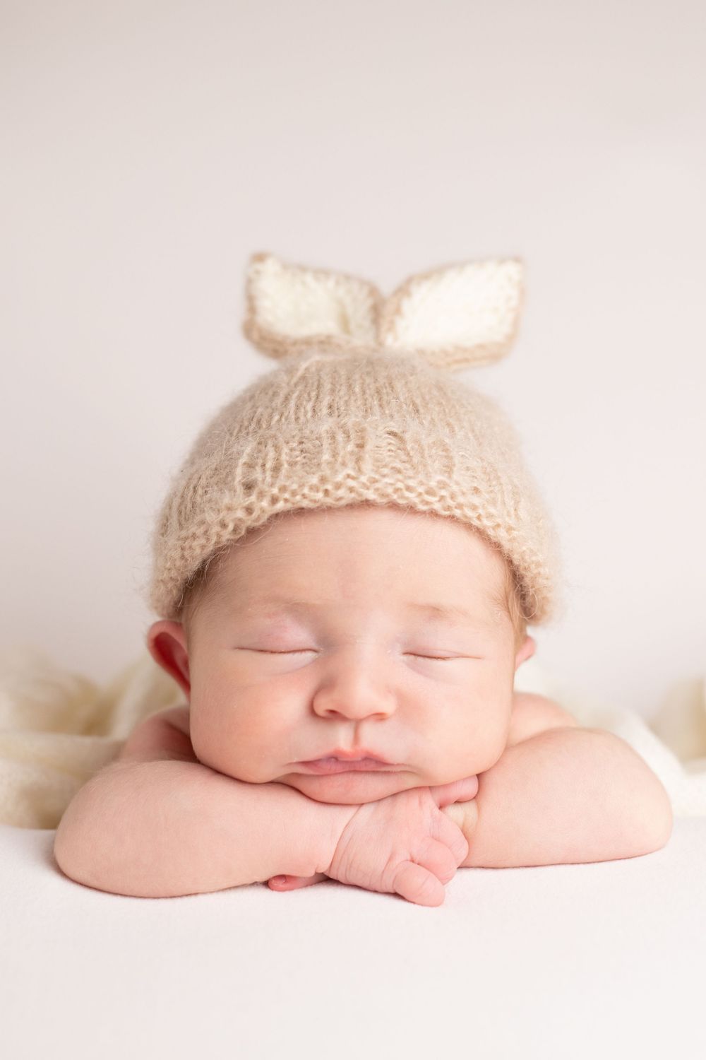 Buffalo In Home Newborn Session Photography. Newborn girl with bunny headband