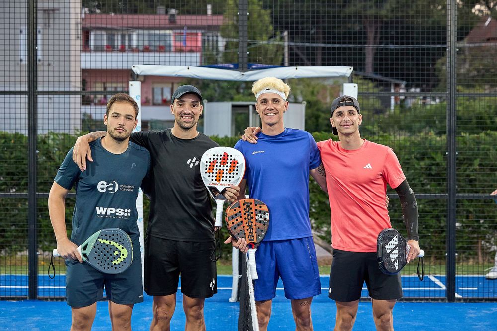 Group of padel players standing together with rackets on blue court.