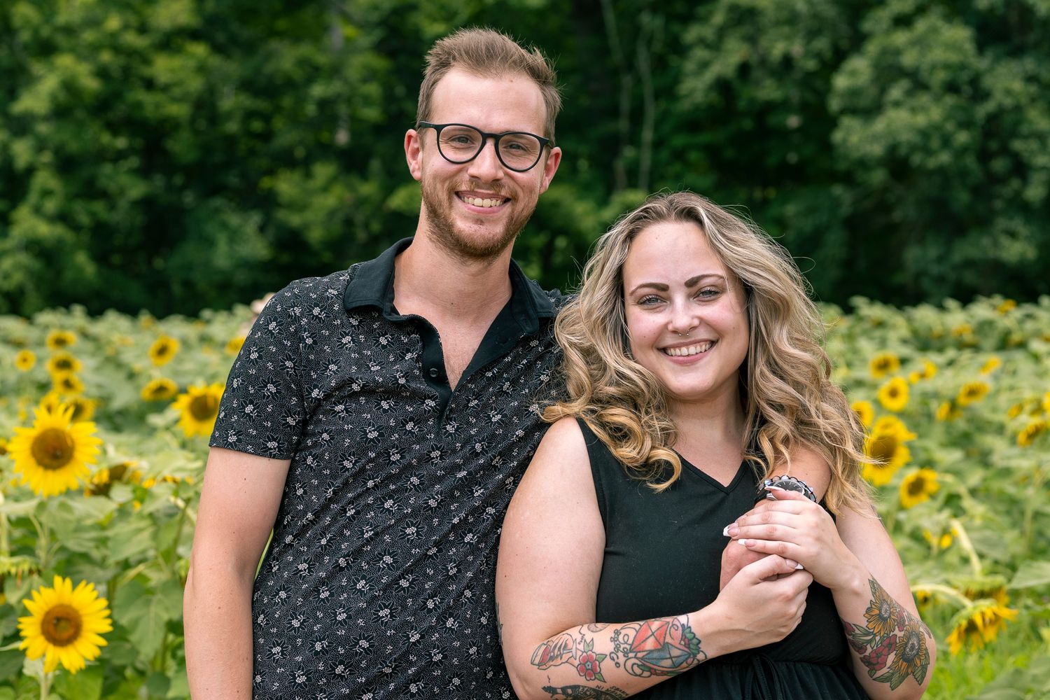 A couple hugging during Sunflower Mini-Sessions