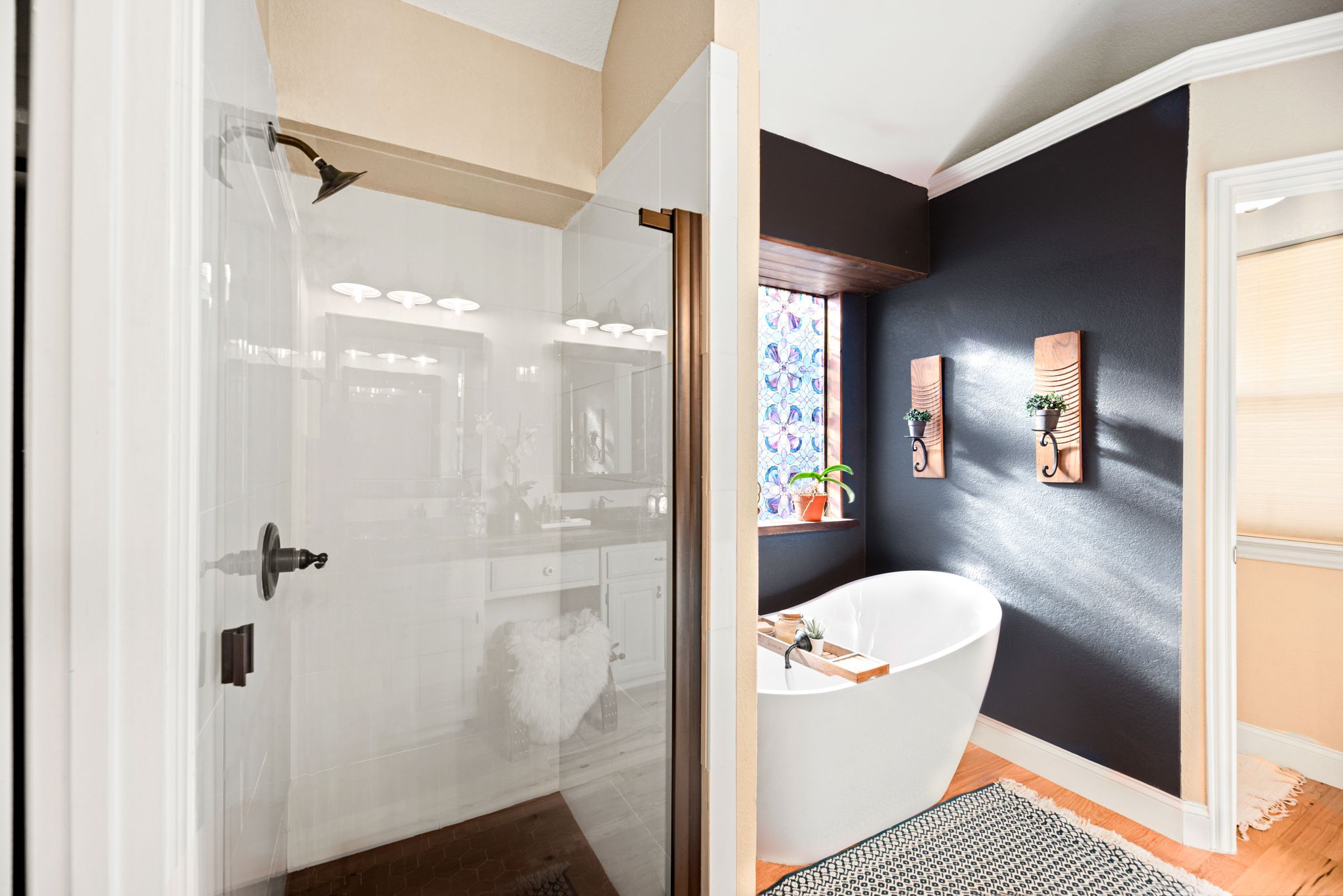 A row of black and white images showing a home interior renovation transformation of a bathroom space.