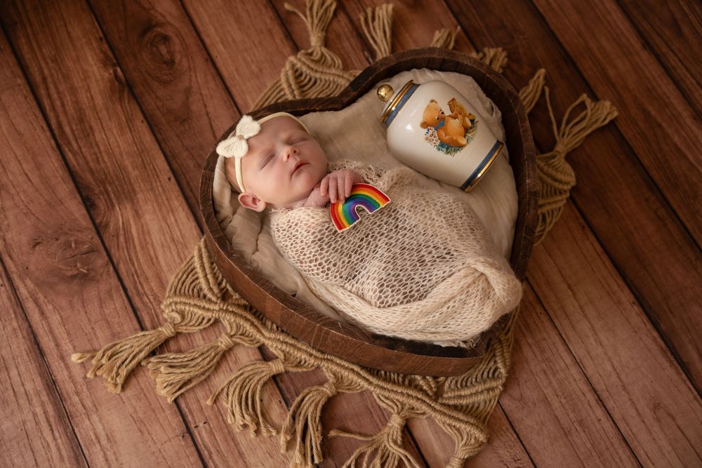 Newborn rainbow baby with urn photography