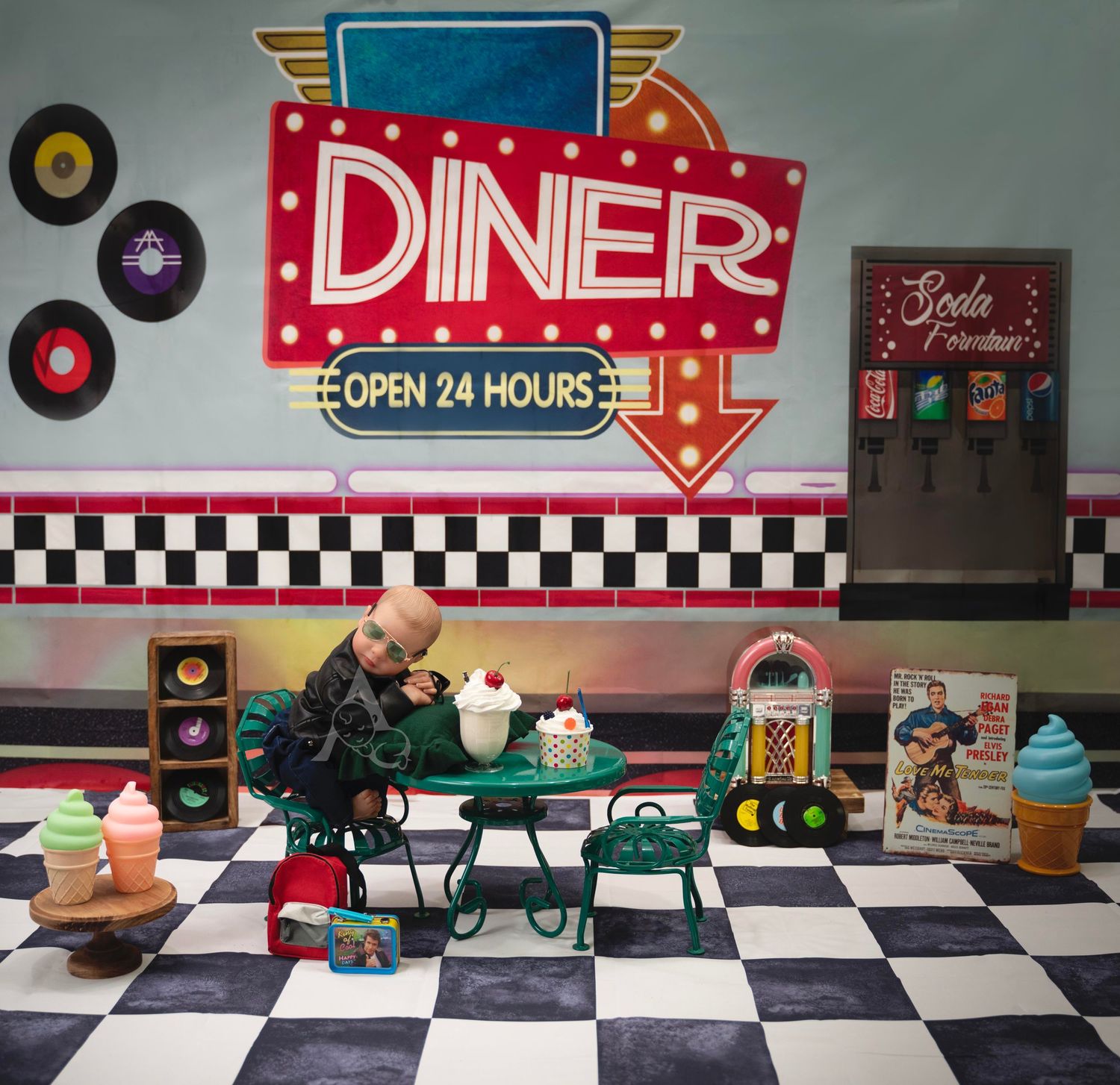 Retro diner interior with checkered floor, neon sign, and vintage decorations including vinyl records on the wall.
