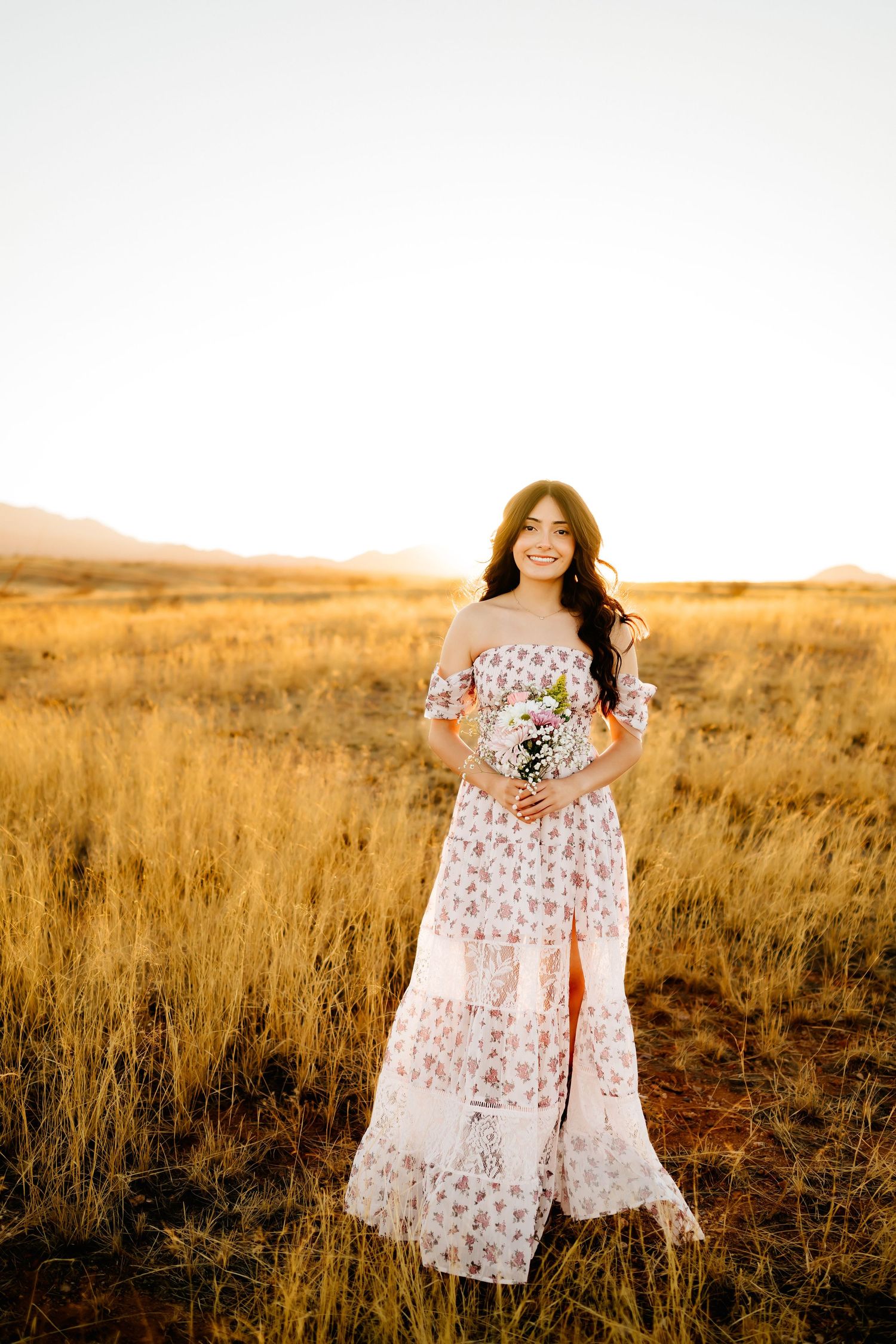 Stunning senior girl in golden hour grassland backdrop near Tucson AZ_02