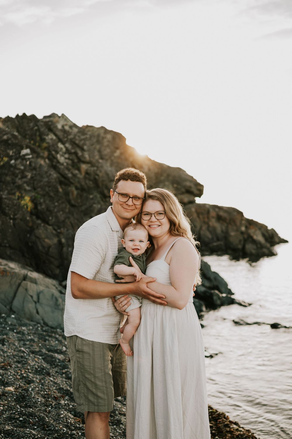 Family portrait smiling at the camera beach at Neck Point Park Nanaimo golden hour family photography by Vancouver Island photographer