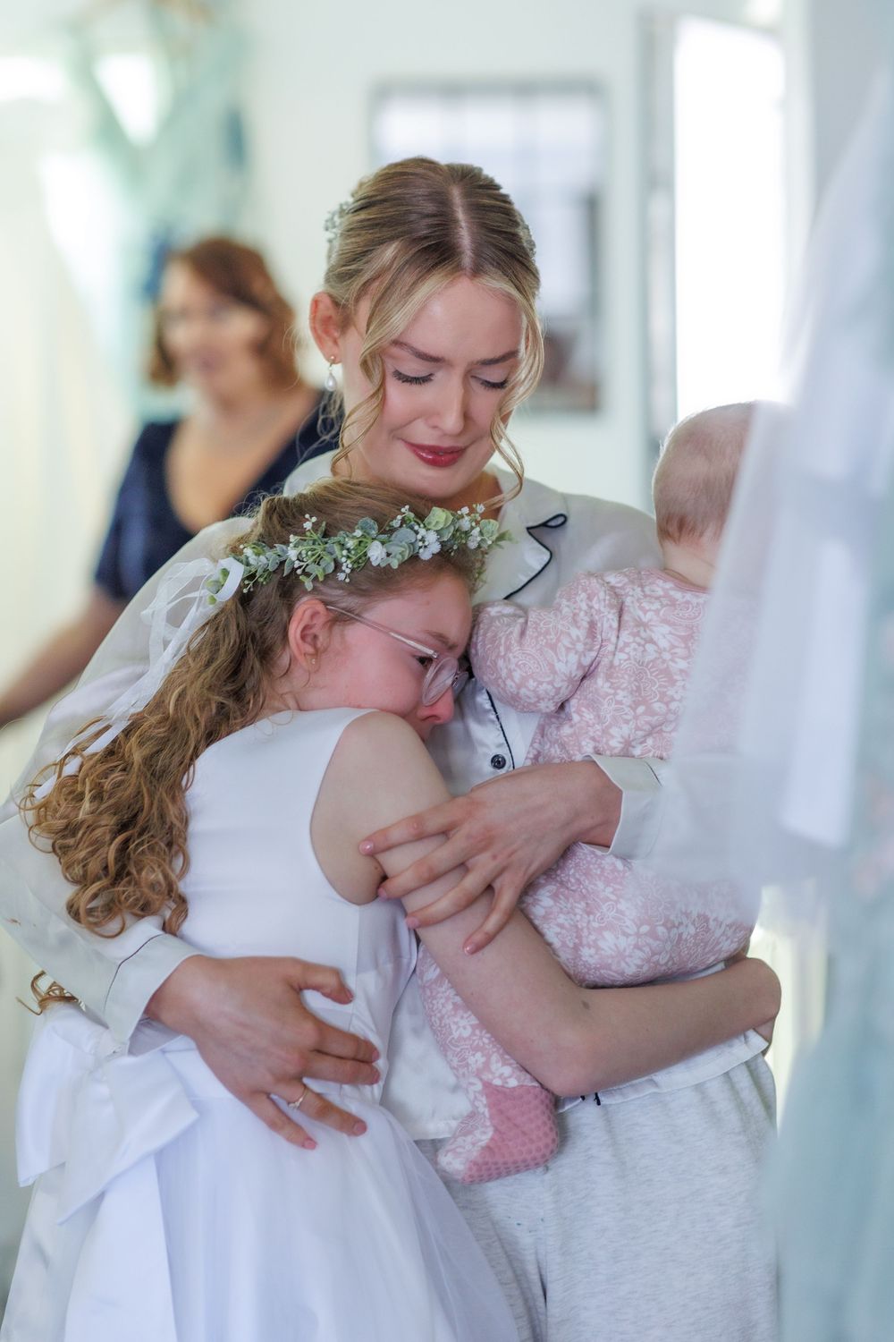 Sweet intimate wedding moments captured in a series of romantic hugs and embraces.
