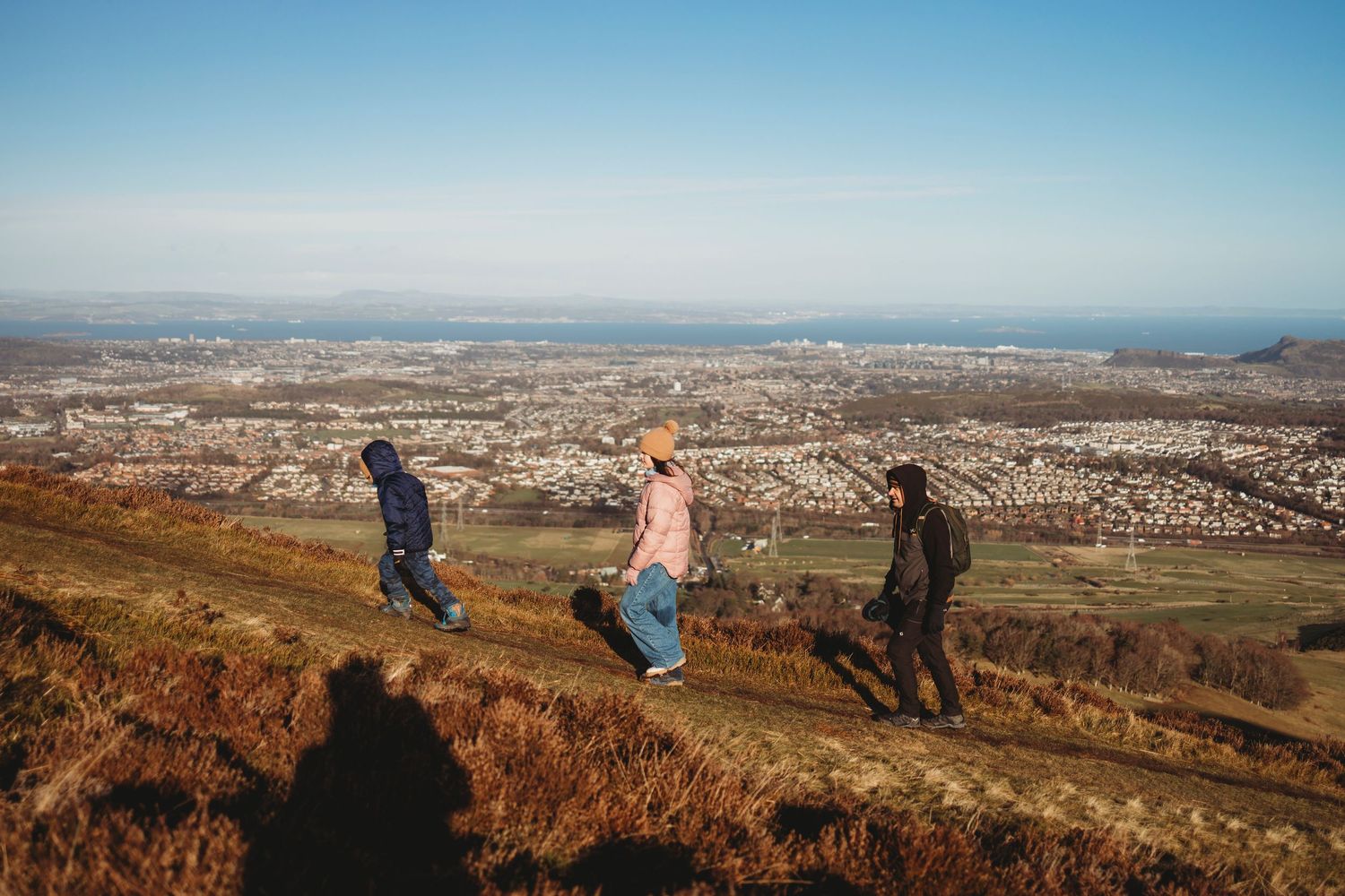 Panoramic sequence of people enjoying scenic mountain overlook views and sunsets with expansive landscapes below.