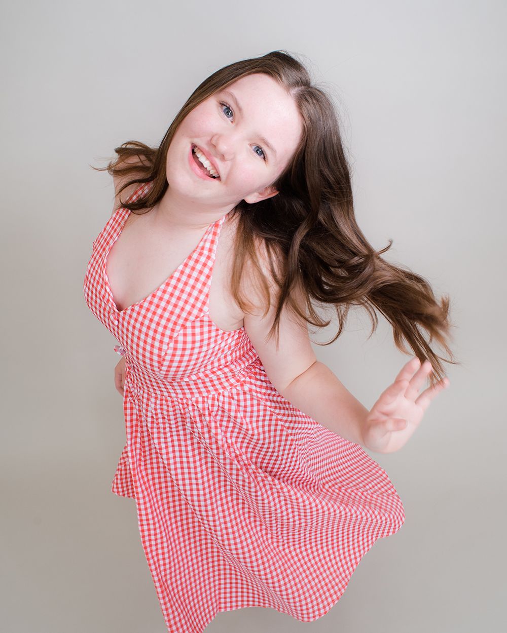 Joyful, personality-packed moment during a children’s acting headshot shoot — taken by Abigail’s Studio in the heart of Buckinghamshire