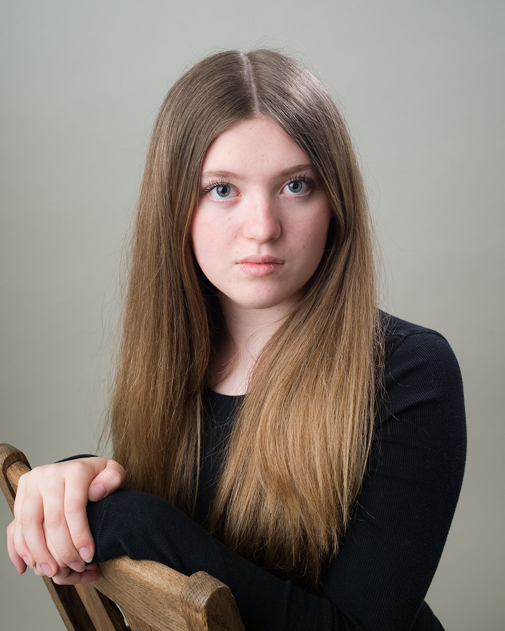 Striking headshot of a child in shadowed lighting, capturing emotional depth — taken at Abigail’s Studio, specialist in theatrical photograp