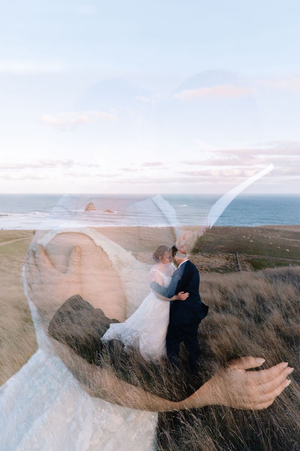 A creative double exposure wedding photo capturing a couple against a coastal landscape.
