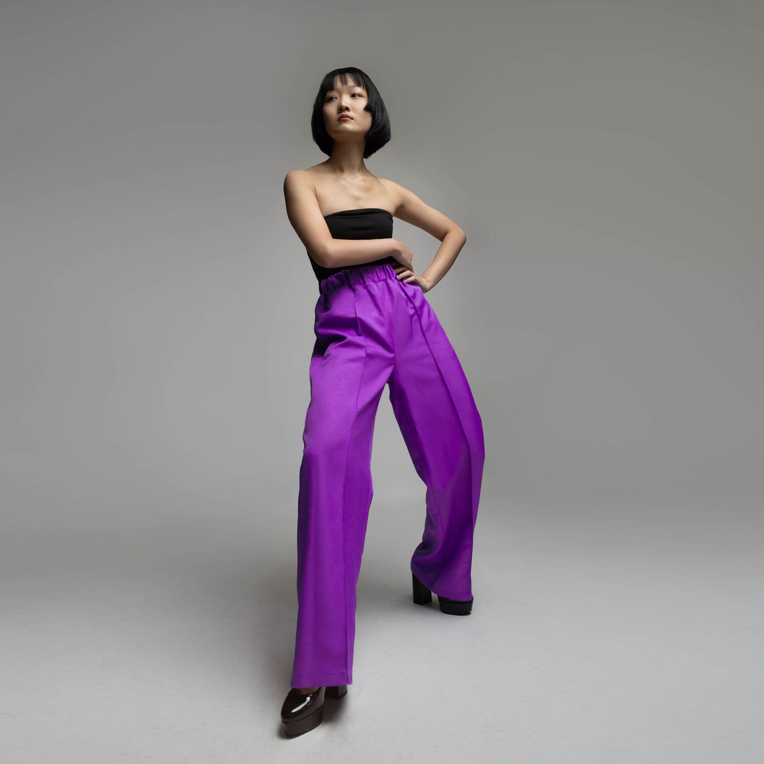 NYC model posing in a minimalistic studio setting.