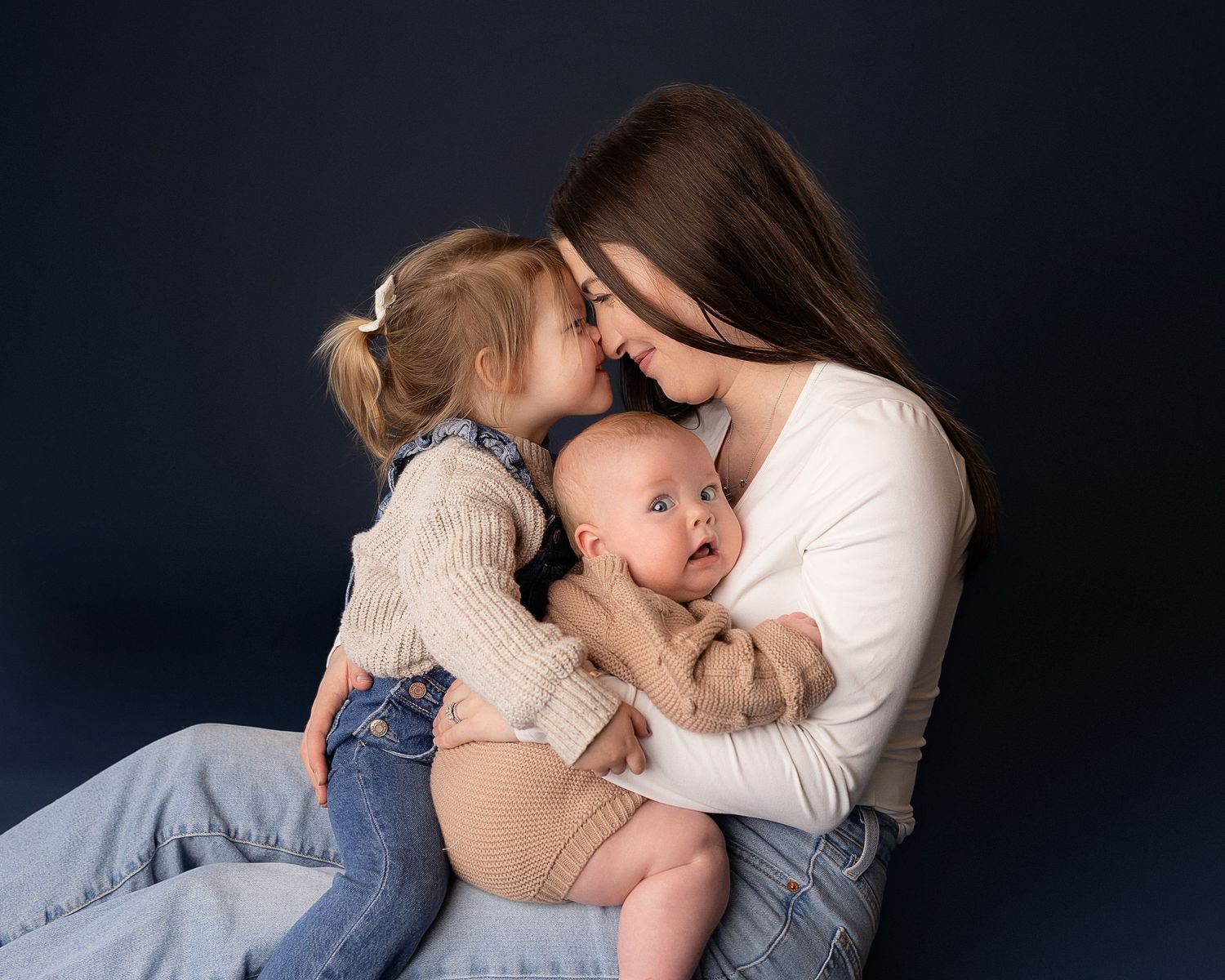 Professional photo of a mother with her two daughters