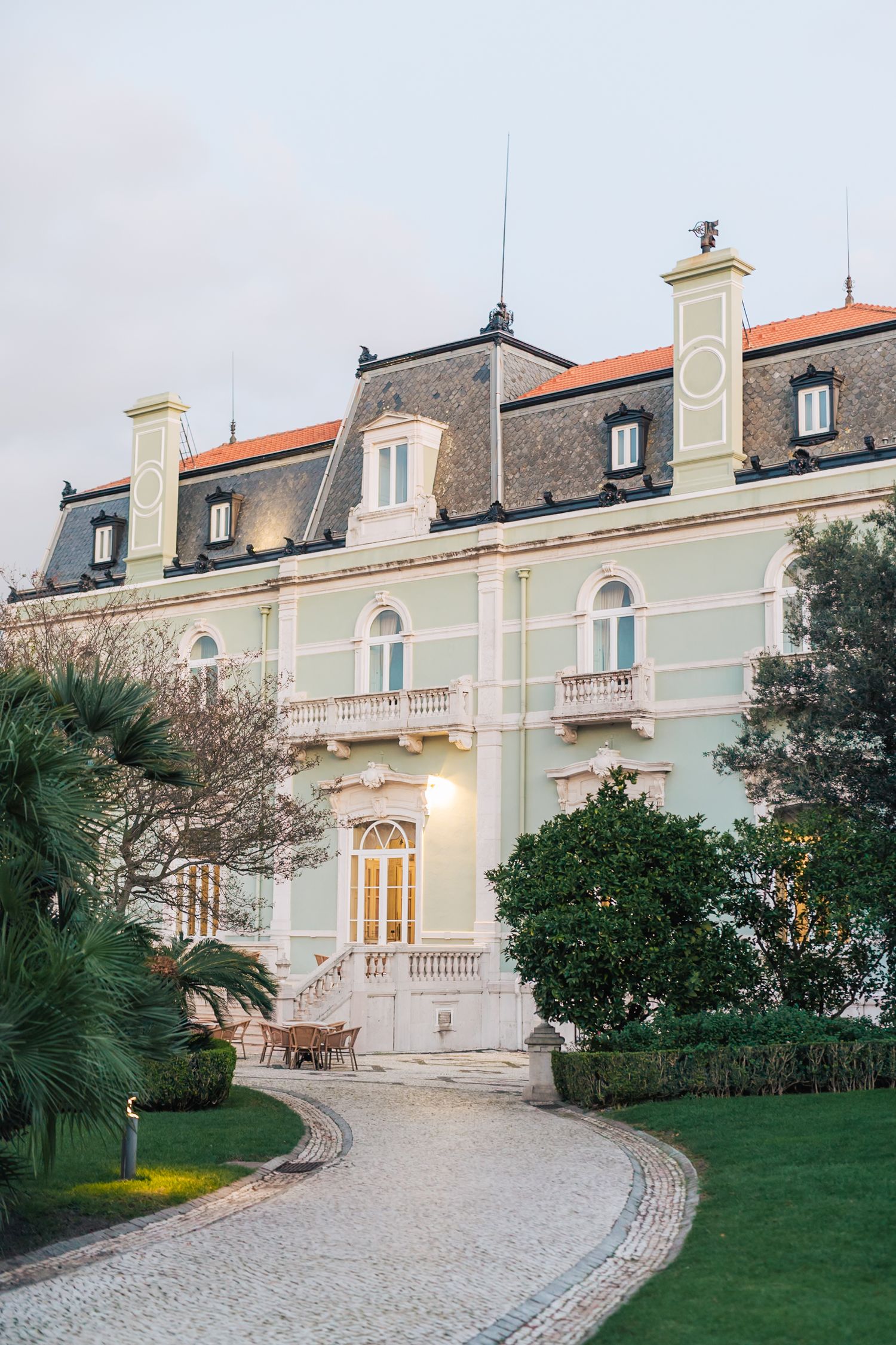 Romantic and sophisticated couple posing in the grand surroundings of Pestana Palace, Lisbon
