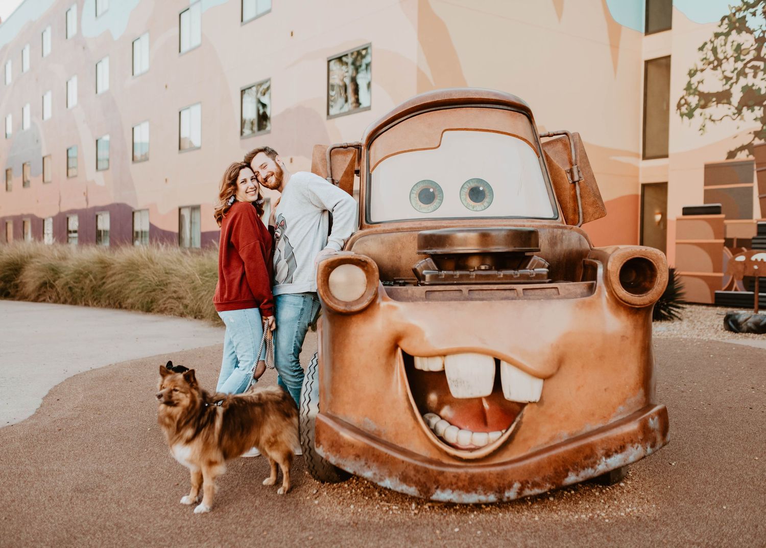 John & Emily anniversary photos at Disney's Art of Animation with Tow Mater & their dogs. Cred: LexTakePix