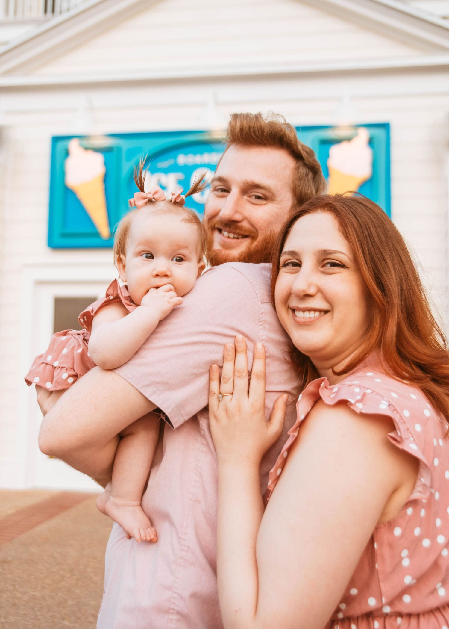 John & Emily anniversary photos at Disney Boardwalk with baby Ripley, at the iconic vintage Photobooth. Cred: LexTakePix