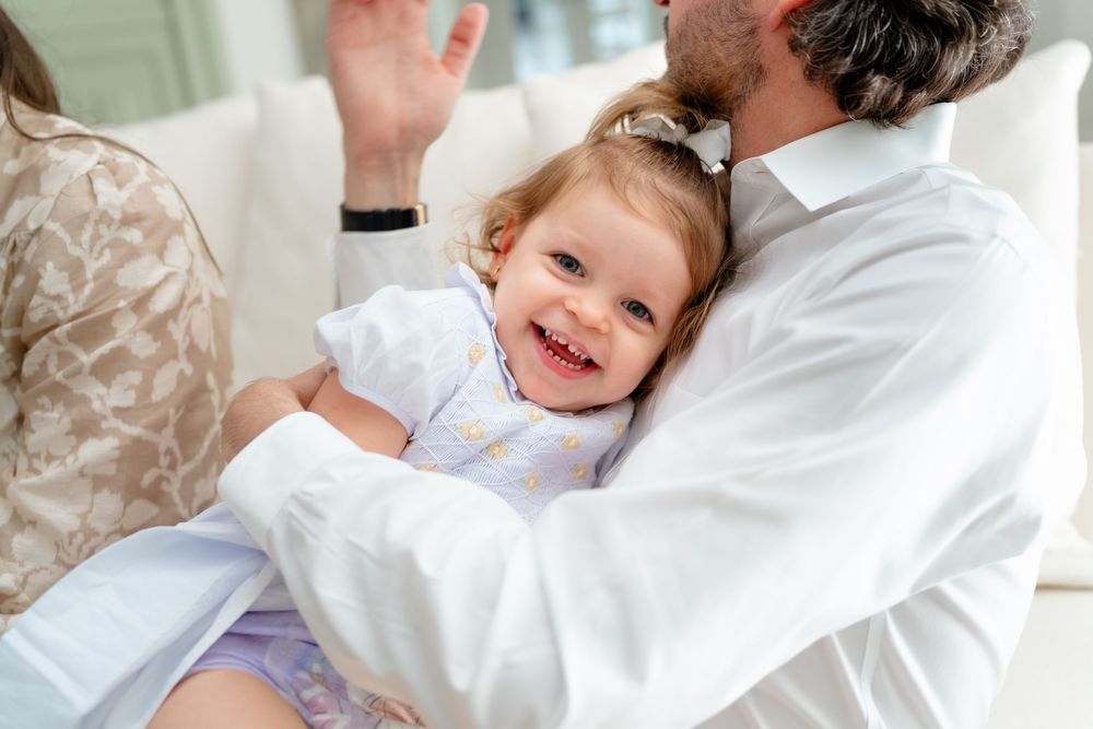 Four connected images showing sweet moments between a healthcare provider and young patient during a medical visit.